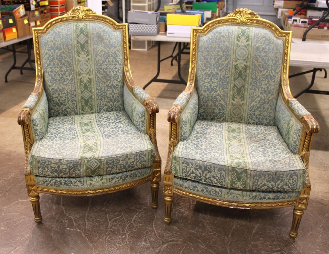 Pair French Carved Upholstered Arm Chairs: Pair of French style carved upholstered arm chairs, upholstery is good, no staining, structurally sound, some paint flaking and loss around joints seen, 30"w x 28"d x 45"h with seat height of 19"