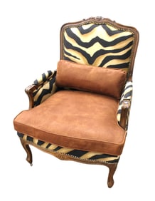 Mahogany framed carved decorator chair with animal print upholstered rough finish leather seat