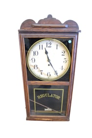 Antique Waterbury regulator hanging wall clock with pendulum, oak base