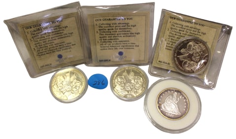 4 US Commemorative coins: 3 with civil war paper work  & 1 half dollar marked copy (coins)
