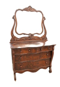 Nice model antique oak serpentine front dresser with beveled mirror and applied carvings