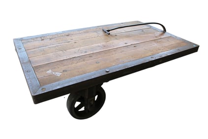 Industrial warehouse cart with pull handle in metal frame and wooden deck, cast iron and rubber