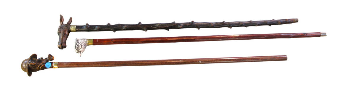 Group of 3 carved novelty walking canes. Approximately 36"l: Group of 3 carved novelty walking canes. Approximately 36"l