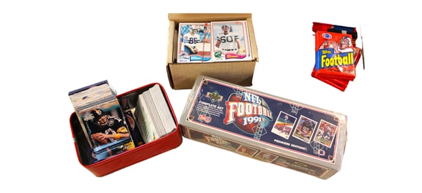Football and Baseball miscellaneous cards in a collector tin