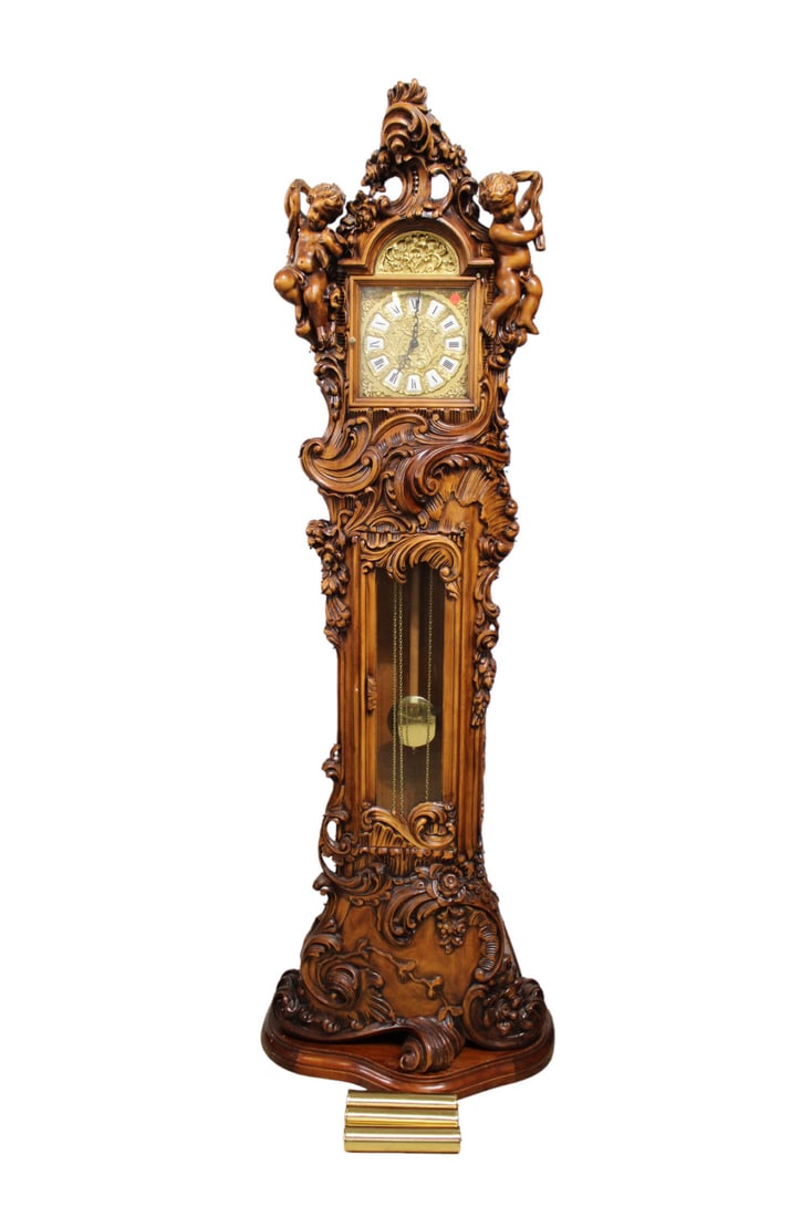Italian cherubs wood case tall grandfather clock 2pc: Italian highly hand carved with cherubs 2 piece wood case tall grandfather clock with brass face, weights and pendulum. Was working in home. Chains need to adjusted to hang the weights. 82"h x 28"w x