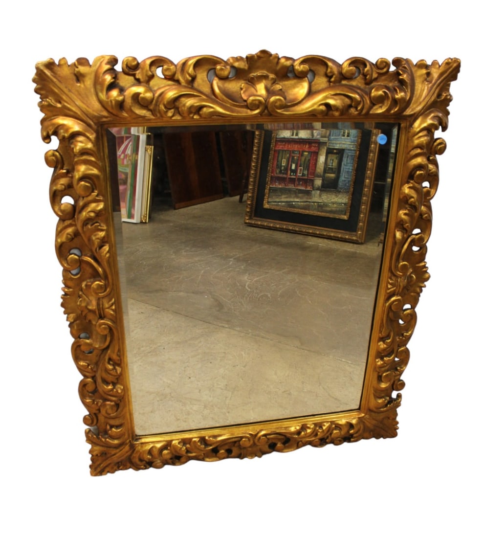 Antique highly carved fancy beveled mirror: Antique wood framed and beveled glass highly carved fancy mirror with original gold finish. Structurally sound and in good condition. No noticeable issues. 39"h x 32"w x 2"d