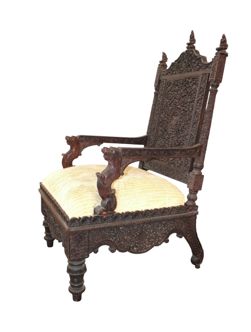Fantastic antique Asian intricately carved arm chair: Fantastic antique middle eastern Asian intricately carved with animals and figures chair in the hardwood, very well pierce carved, original finish, structurally sound, upholstery may need cleaned. Goo