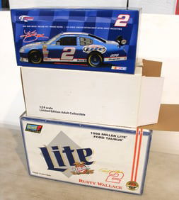 2 boxes: Diecast Real Stamped Car in box and 1998 Miller Ford Taurus Revell Collection 1/18 scale