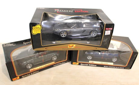 3 diecast cars: Maisto Special Edition Audi TT Roadster, Mini Cooper (sun roof) and Bonus Porsche