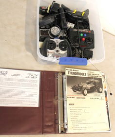 Assortment of remote controls, owners manuals in binder, working unknown