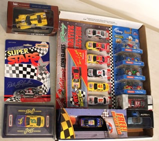 12 Motorama, Disney, Matchbox and other collectible cars in unopened original packages