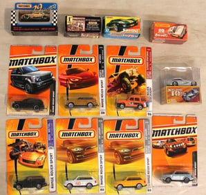 13 Matchbox cars some autographed in unopened original packages