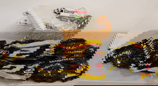 Mixed lot basket of race car banners, NASCAR racing memorabilia, inflatable car