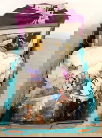 Box of misc. key chains, badges, race buttons, hats, Camel Continental Watkins Glen, and jaguar