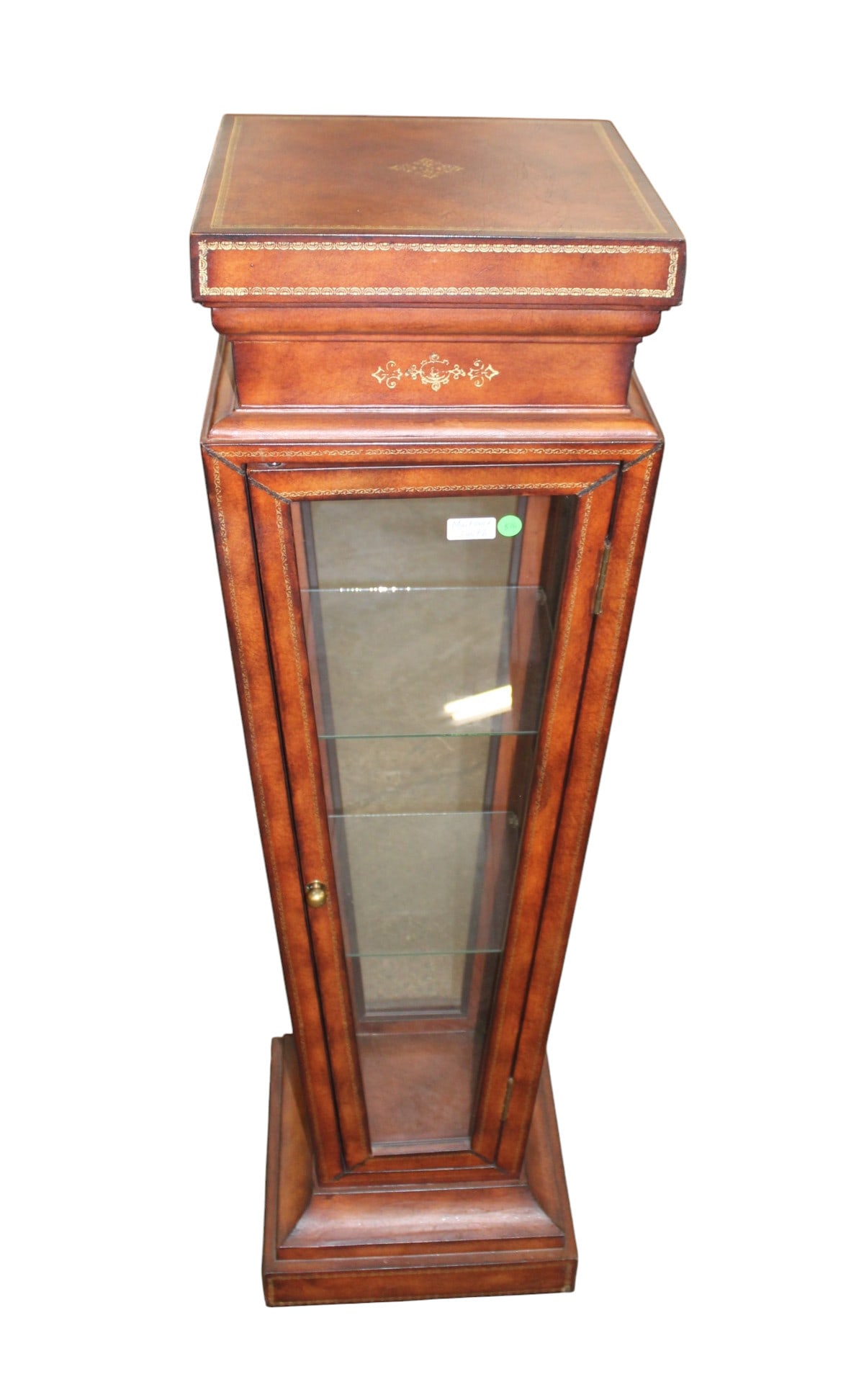 Maitland Smith leather wrapped display pedestal: Fantastic Maitland Smith leather wrapped display pedestal with door and 2 glass shelves, structurally sound, good condition, original finish. (matches Lot #517) 48"h x 14"w x 14"d