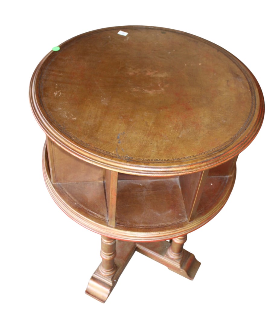 Vintage leather top rotating round book table in the mahogany: Vintage leather top rotating round book table in the mahogany, structurally sound and does show age. 29"h x 22" diameter