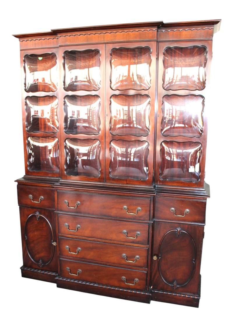 Semi antique bubble glass breakfront china cabinet: Semi antique 2 piece bubble glass breakfront china cabinet in the mahogany, leather top desk in drawer, structurally sound and in good condition for age. All glass is good. 79.5"h x 60"l x 17"d (top 4