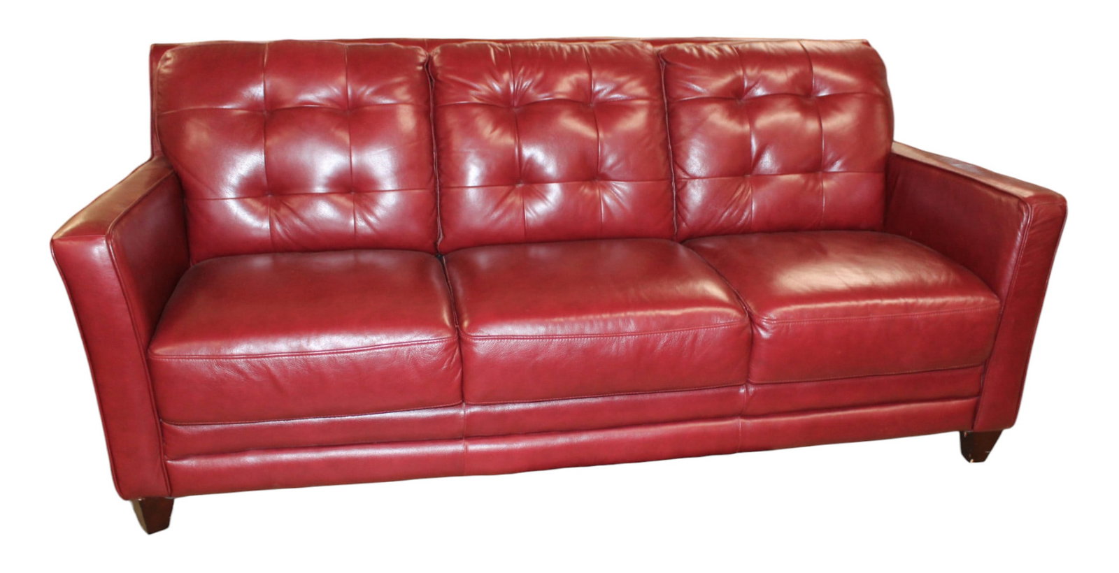 Nice 3 cushion red leather modern design sofa: Nice 3 cushion red leather modern design sofa, no rips or tears, structurally sound and in good condition. 38"h x 82"l x 36"d with seat height 19"