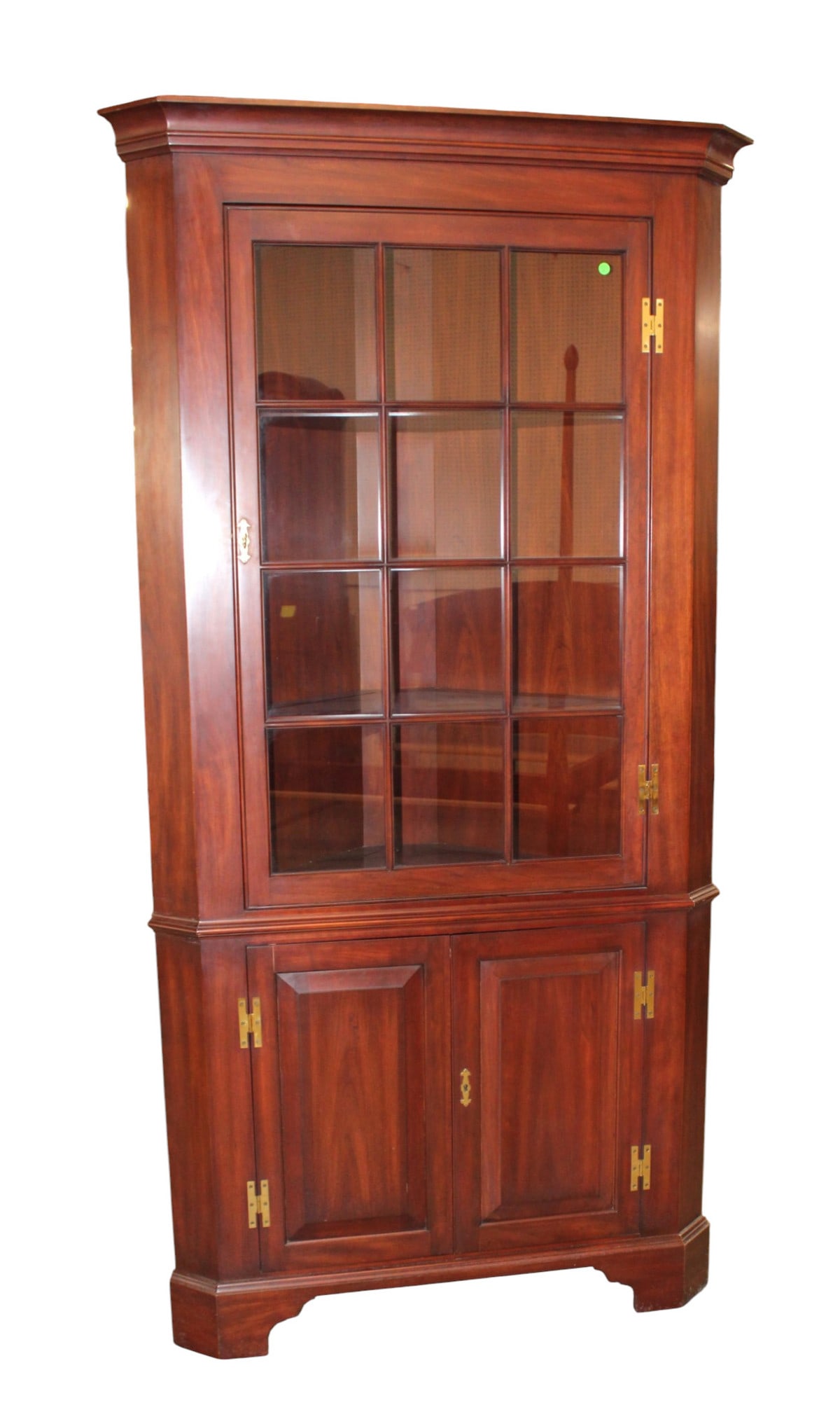 Henkel Harris 12 pane solid cherry corner cabinet with key: Henkel Harris 12 pane solid cherry corner cabinet with key, structurally sound and in good condition with small cut out hole in back, original finish. 84"h x 42"w x 23"d
