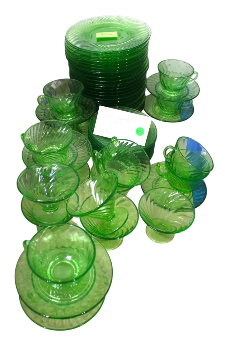 63 pcs. green depression glass 8" plates, cups, saucers: 63 pieces of green depression glass consist of 8" plates and cups and saucers, no noticeable issues seen.