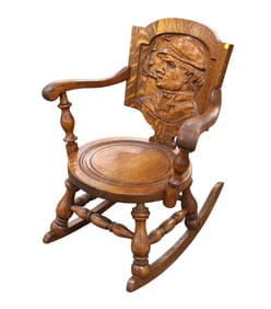 Antique pub rocking chair with carved man smoking cigar, quartersawn oak