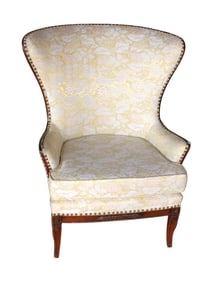 Vintage mahogany framed carved wing back chair