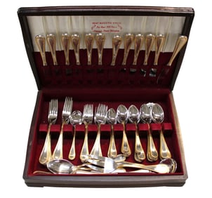 Vintage Towle Germany 76 pieces stainless steel with gold accent flatware set in mahogany case.