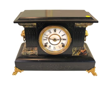 Antique mantle clock in the black lacquer with paw feet