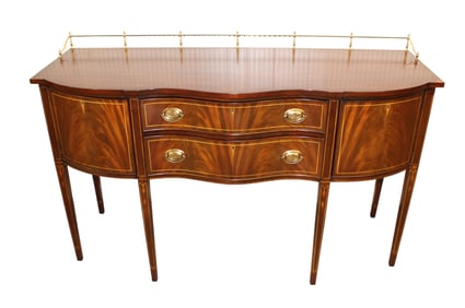 Henkel Harris mahogany serpentine inlaid sideboard with brass gallery, bell flower inlay, tapered