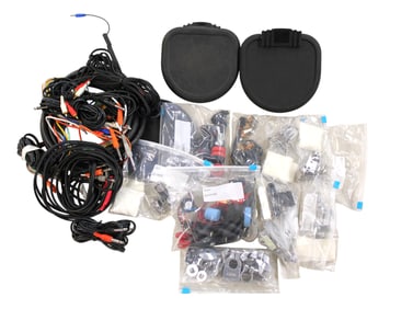 Box of believed synthetic drum pads, wires and other