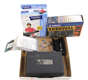 Box of drum keys,  drum dial precision drum tuner, kit trigger, guitar accessory pack and portable