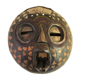 Asian hand carved masked with beading. 12" diameter x 4"h