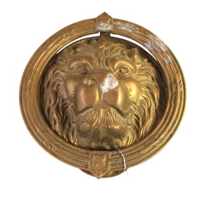 Bronze lion head door knocker, has patina. 8" diameter