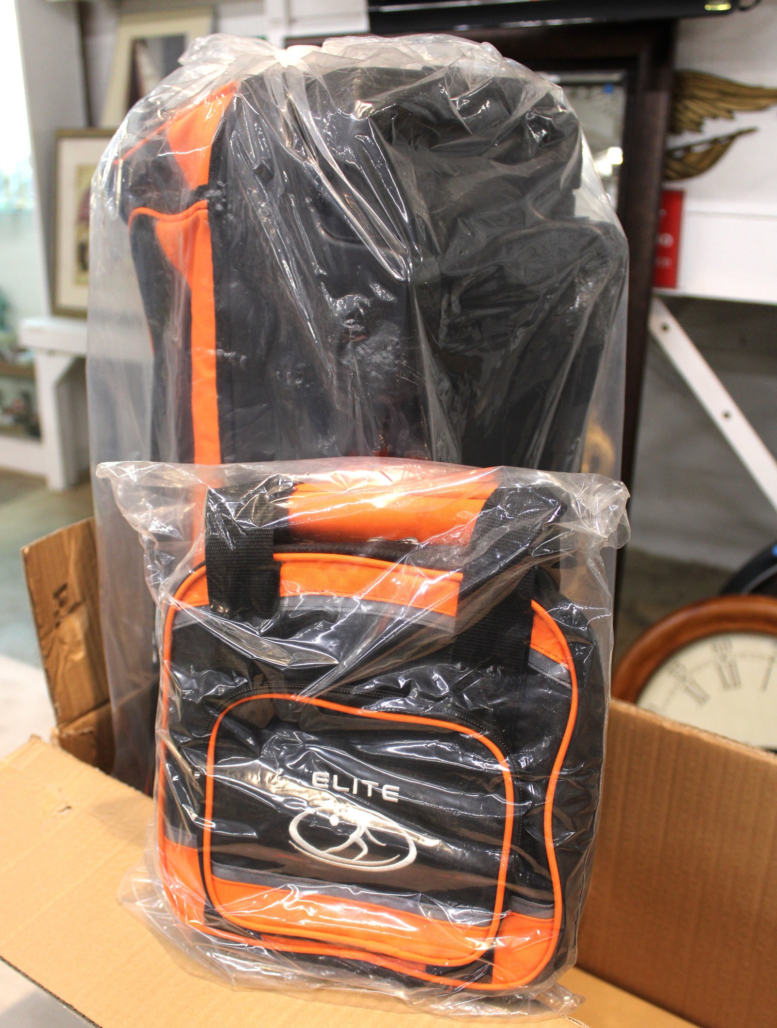 New Elite SE Deluxe rolling 3 ball bowling ball bag: New Elite SE Deluxe rolling 3 ball bowling ball bag model 38958 orange/black/grey new in original box.