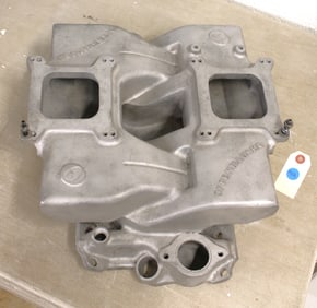 New Offenhauser dual carburetor high rise aluminum intake manifold for small block Chevy.