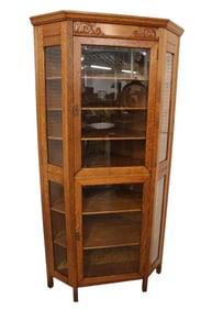 Antique oak corner cabinet  with beveled glass