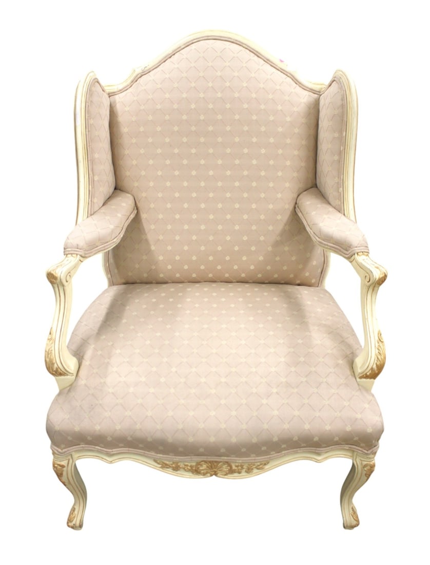 Over size country french arm chair: Over size country french arm chair, upholstered in white and gold decorative frame. Nice form. Structurally sound and in good condition. 41.5"h x 32"w x 28"d with seat height 17"