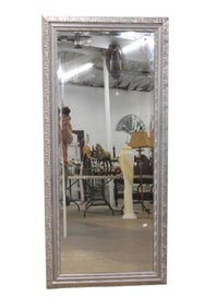 Full length beveled glass wall mirror in carved frame