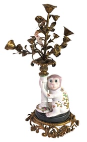 Porcelain monkey with bronze face and bronze flowers