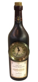 Wine bottle shaped quartz clock. 13.5"h x 4"d
