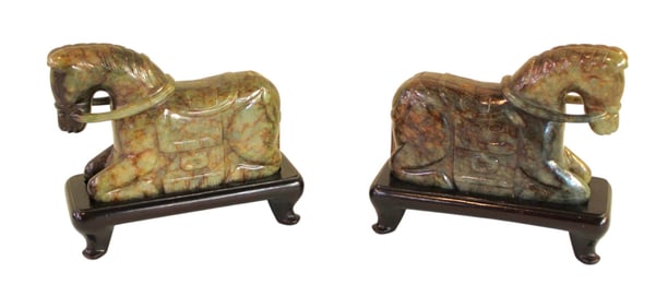 Pair of jade style Chinese horses on wooden stands