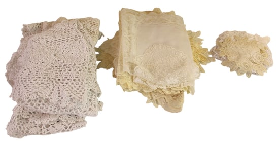 Selection of vintage lace table runners and doilies.