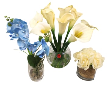 3 decorative faux floral arrangements in clear glass