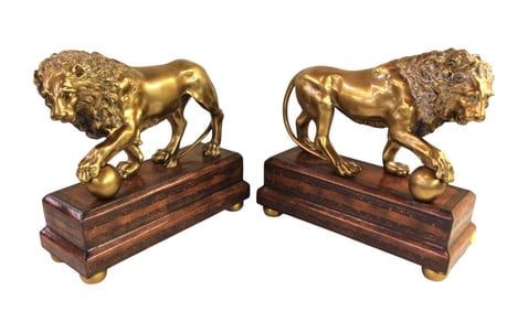Pair of beautiful Theodore Alexander full body bronze lions on leather wrapped bases
