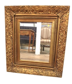 Carved gold framed beveled glass mirror
