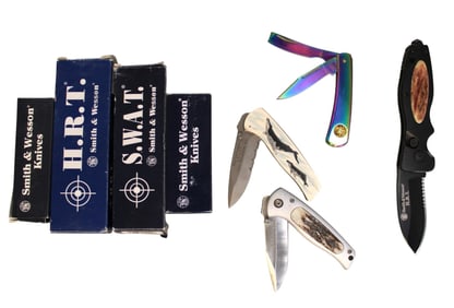 4 Smith and Wesson knives, 2 1st millennium run