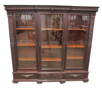 Antique RJ Horner style wavy glass carved bookcase: Beautiful antique solid mahogany highly carved 3 door wavy glass, 3 drawer, 9 wooden adjustable shelves, bookcase in the manner of RJ Horner Furniture, original finish, structurally sound, good condit