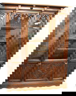 Antique gothic walnut bookcase w/wavy glass & key: Impressive antique gothic style 3 door solid walnut bookcase with original wavy glass and key, 10 adjustable wooden shelves, original finish, structurally sound, good condition. Breaks down to 12 piec