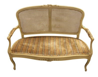 Vintage cane back french style upholstered settee: Vintage cane back french style upholstered settee, distress painted frame, upholstery has wear, structurally sound. 38"h x 15"w x 22"d seat height 17"
