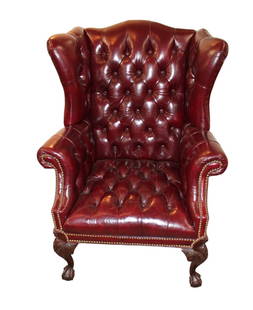 Quality burgundy leather  button tuft wing back chair: Quality burgundy leather style button tuft wing back chair with mahogany frame, ball and claw feet, no rips tears or smells, structurally sound and in good condition. 44"h x 35"w x 28"d seat height of